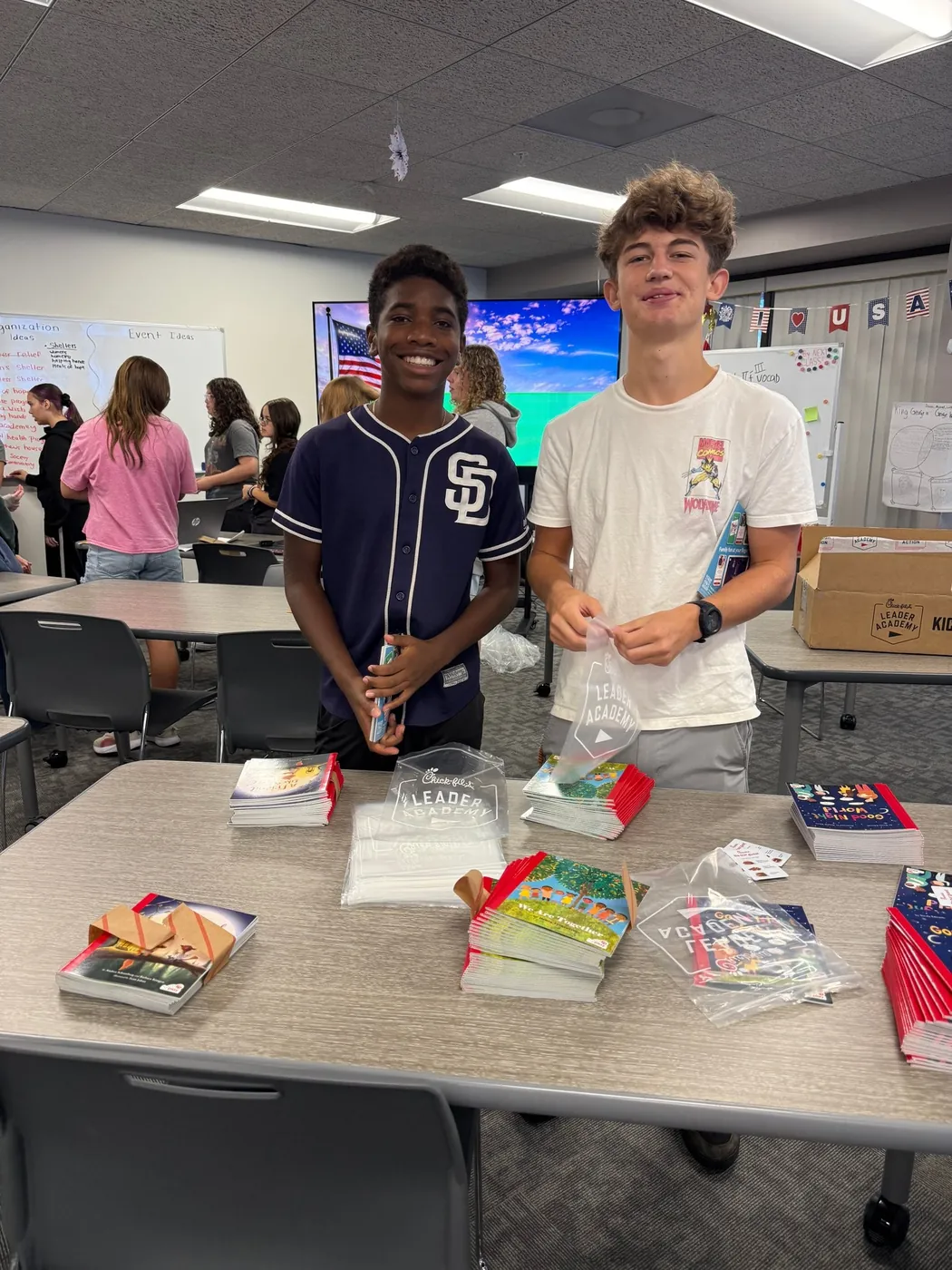 Two students smiling in a Naples classroom